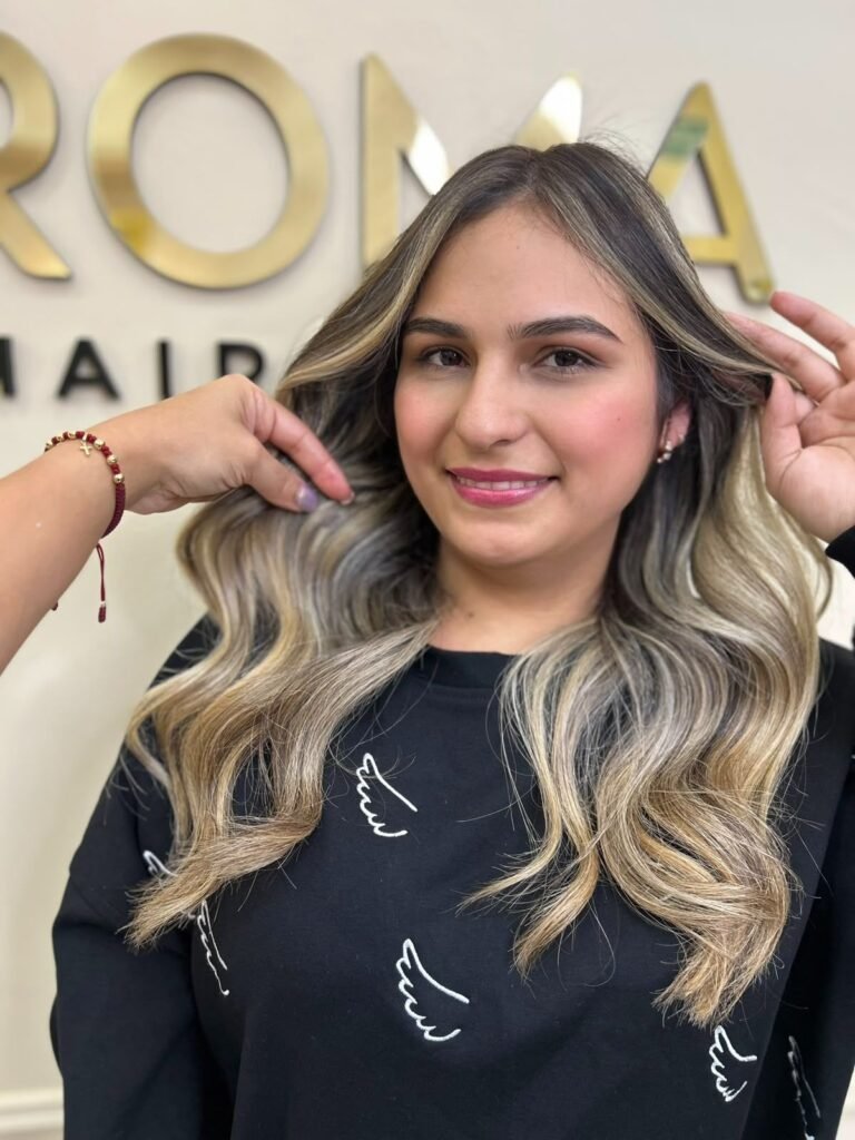 Warm balayage after getting her hair done in Laureles at Roma Hair Salon