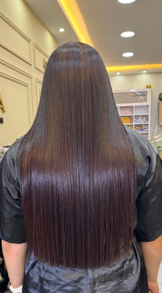 Long, smooth hair after organic straightening at Roma Hair Salon, Laureles, Medellín